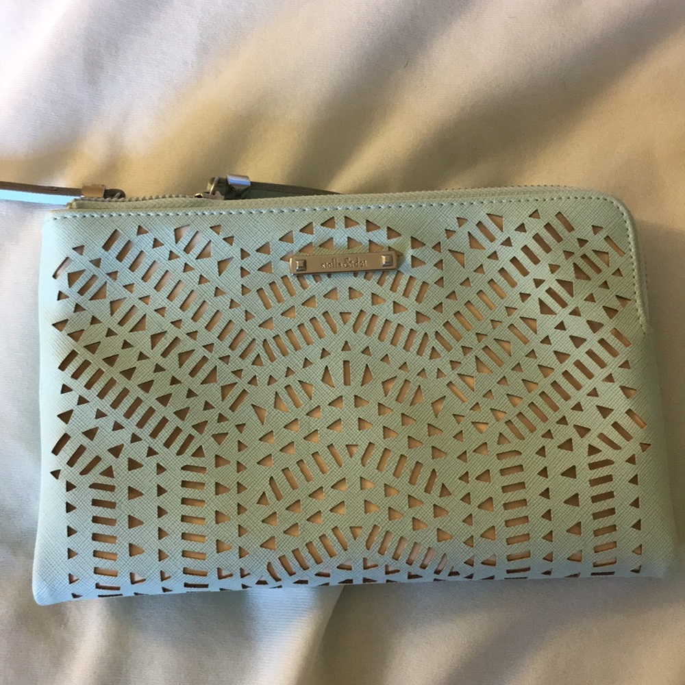 Clutch with dual pockets and a mirror